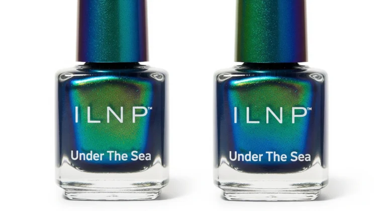 ILNP Under The Sea nail polish bottle with multi-chrome finish showing teal to emerald to sapphire blue color shifts with holographic sparkles on white background