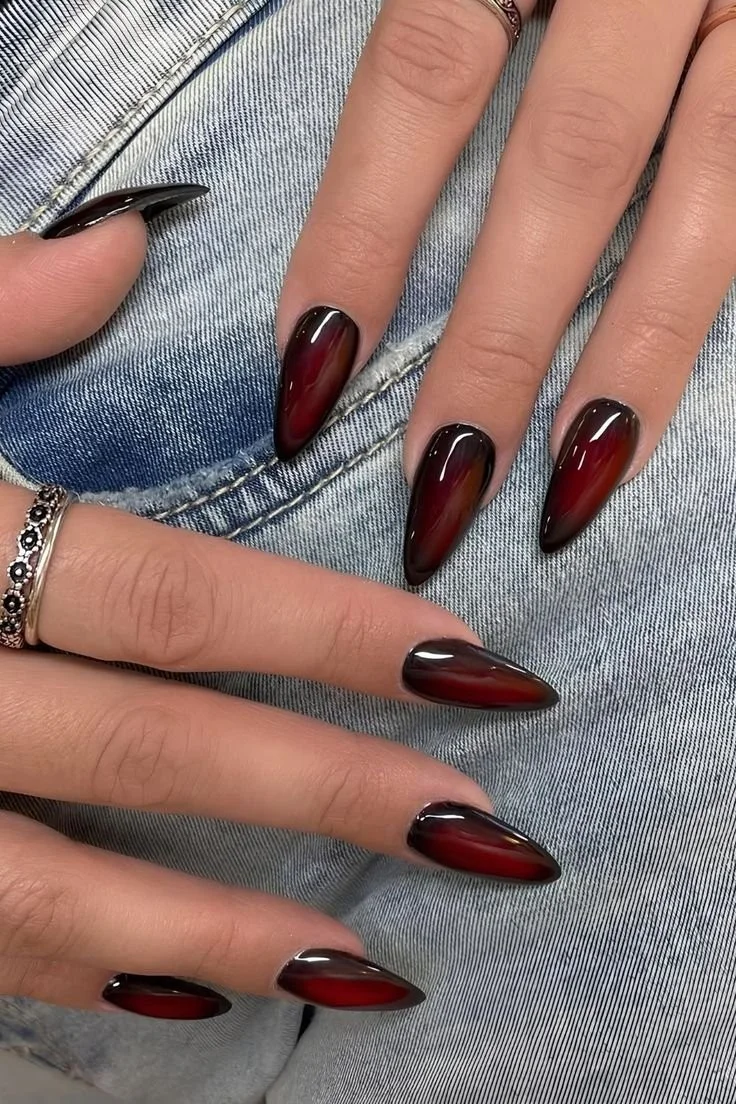 Trendy cherry red nails showcasing various designs for 2025.