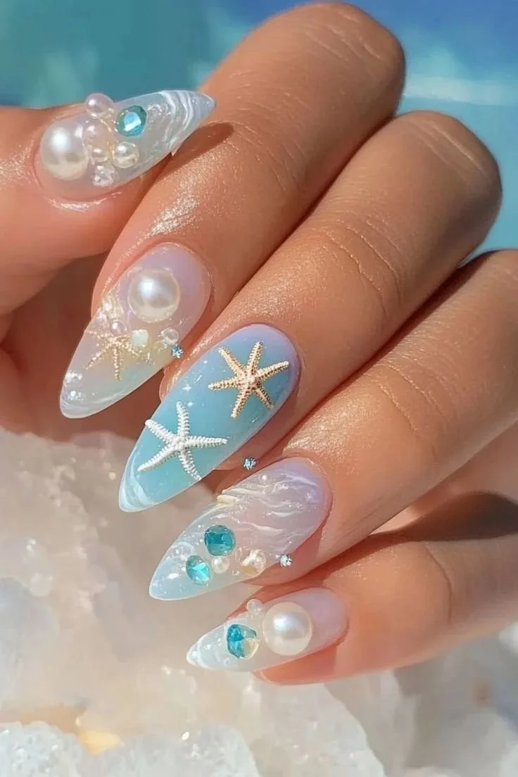 Beautiful sea-inspired nails showcasing ocean colors and designs.