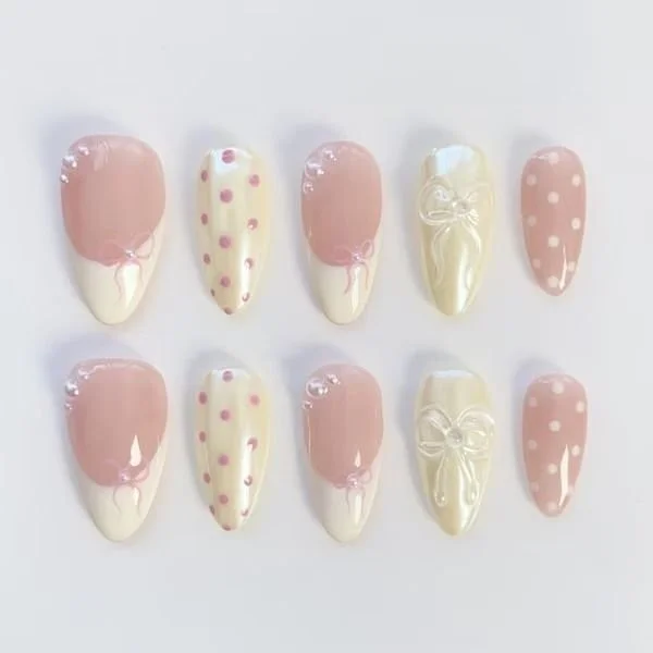 Cute polka dot nails design showcasing colorful dots on a light background