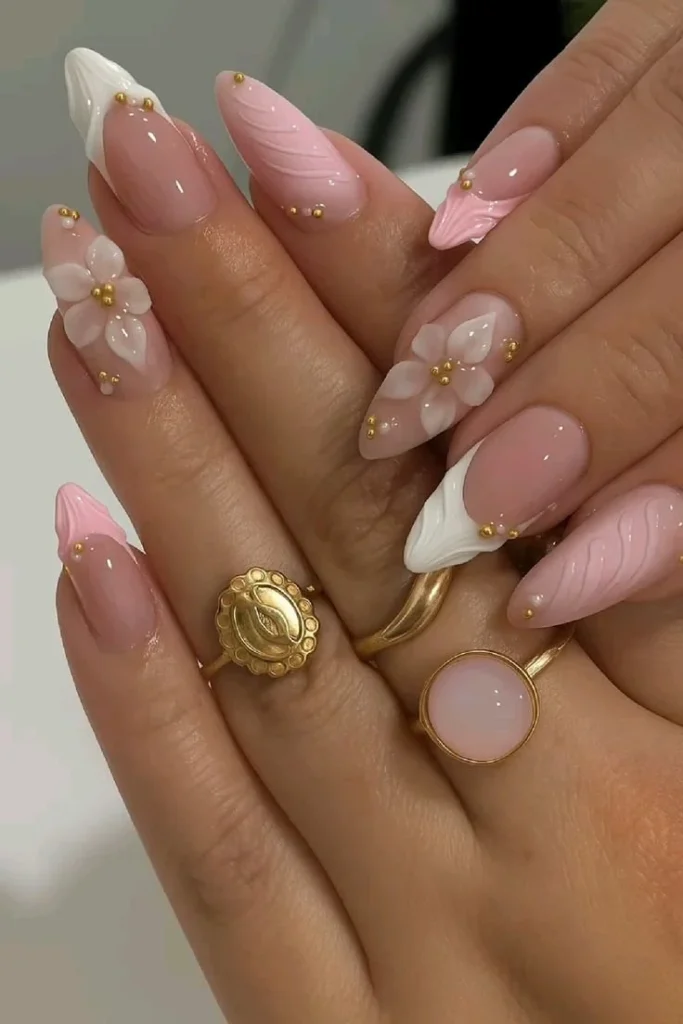 Elegant 3D floral French nails in pink and white almond shape design
